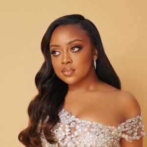 Quinta Brunson smiling at an awards event, creator and star of Abbott Elementary