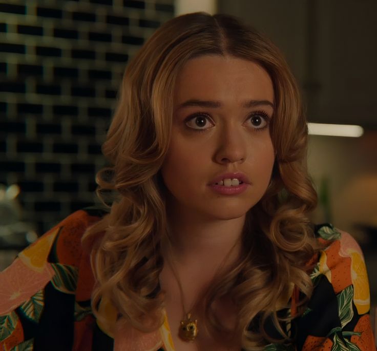 Aimee Lou Wood smiling on set, British actress and BAFTA winner