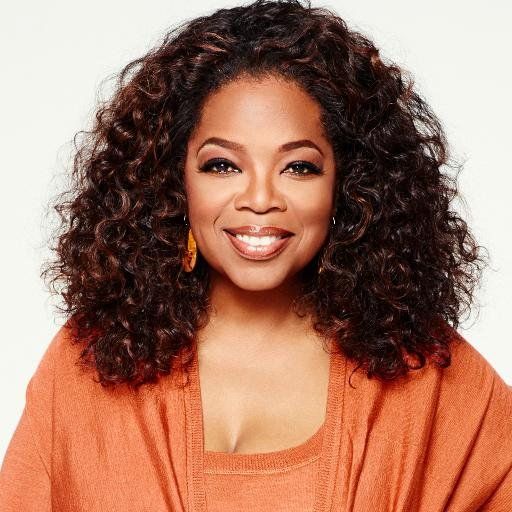 Oprah Winfrey smiling at a public event, representing her media empire and influence