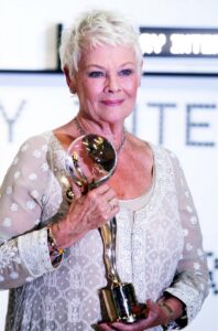 Judi Dench receiving an award at a film ceremony