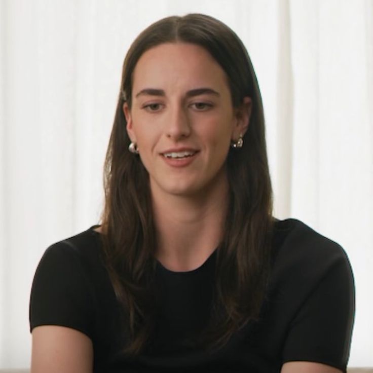 Caitlin Clark shooting a deep three-pointer during an Iowa Hawkeyes women’s basketball game