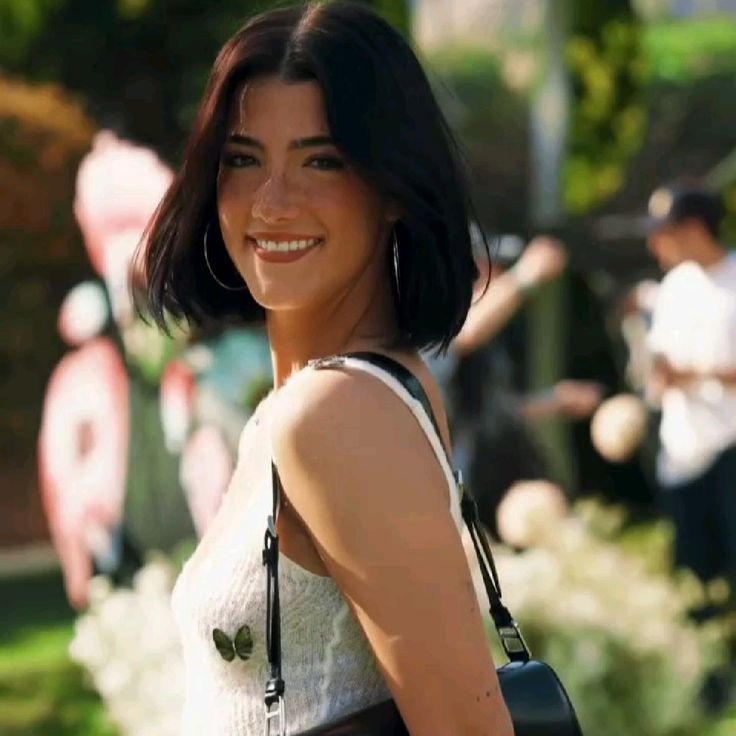 Charli DAmelio performing TikTok dance, co-founder of Social Tourist, and digital entrepreneur