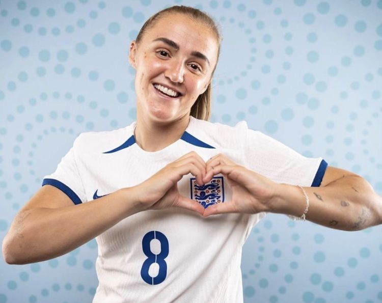 Georgia Stanway celebrating after scoring a powerful long-range goal for England during an international match