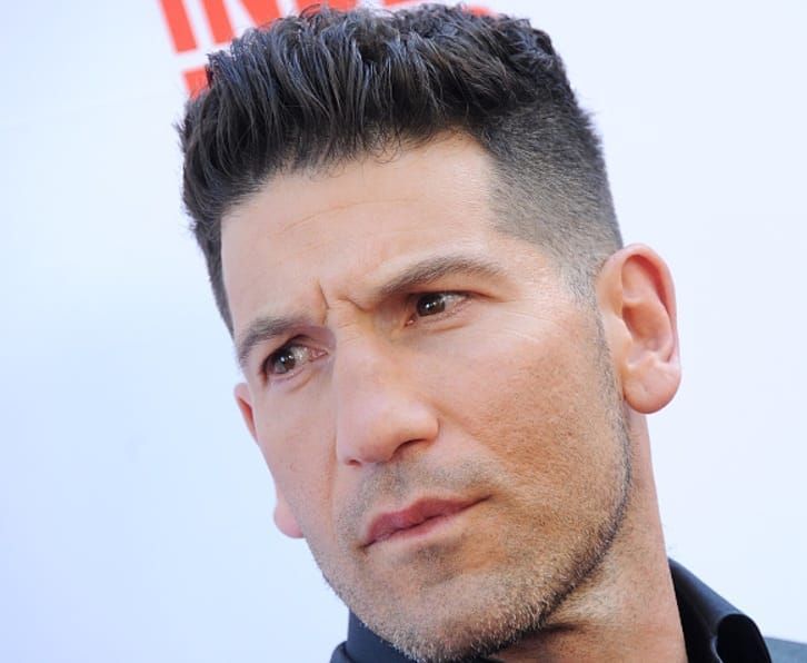 “Jon Bernthal posing on the red carpet, Emmy-winning actor known for The Punisher and The Walking Dead.”