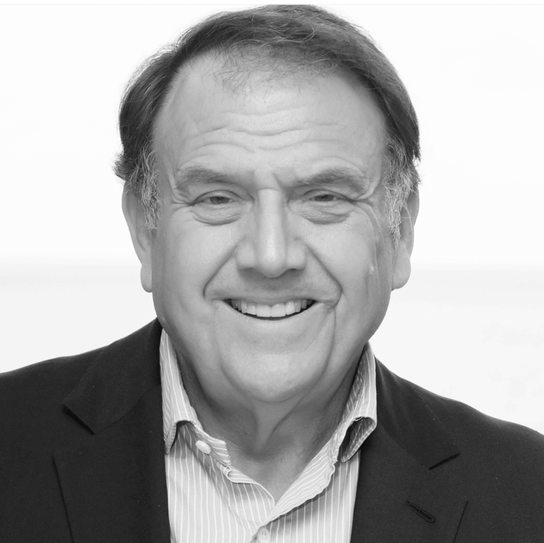 10 Powerful Facts About Richard LeFrak: Billionaire Real Estate Visionary Richard LeFrak standing in front of LeFrak City, Queens, New York, highlighting his real estate empire