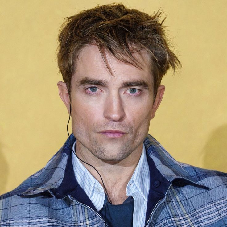 "Robert Pattinson as Batman in The Batman, Hollywood actor and Twilight star, attending a red carpet event"