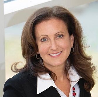 Lauri Union, family business leader, speaking at an entrepreneurship conference at Babson College, representing leadership and business success